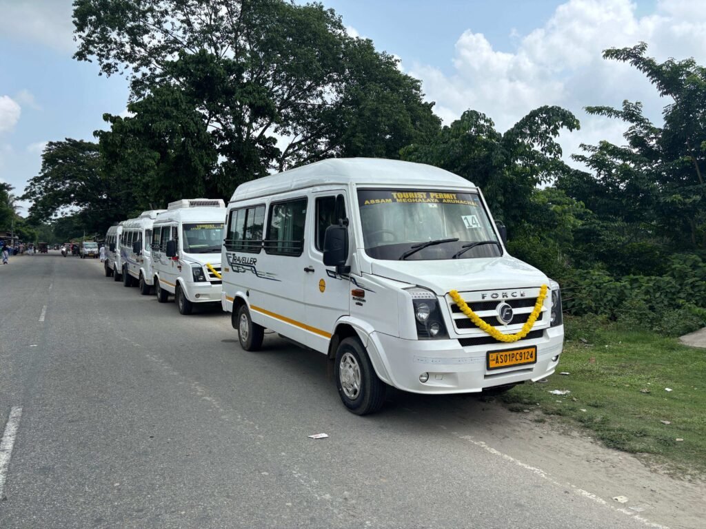 White Tempo Traveller at a pickup point