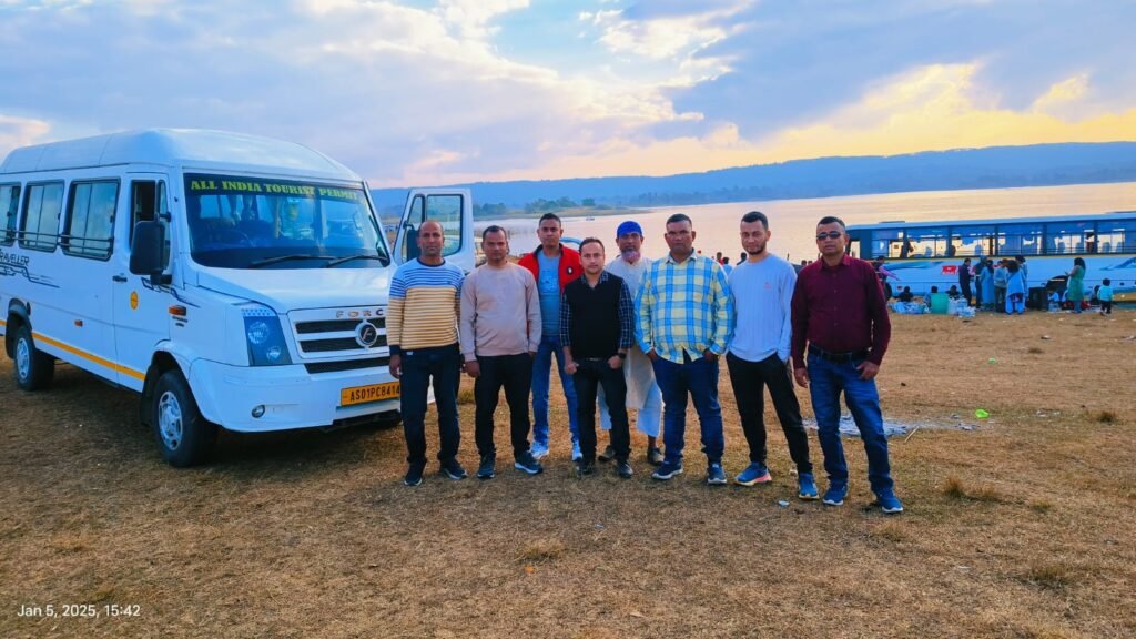 Tour group beside a Tempo Traveller