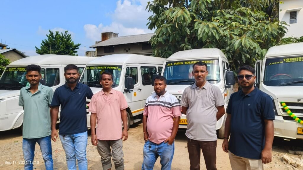 Travel group beside a tour vehicle