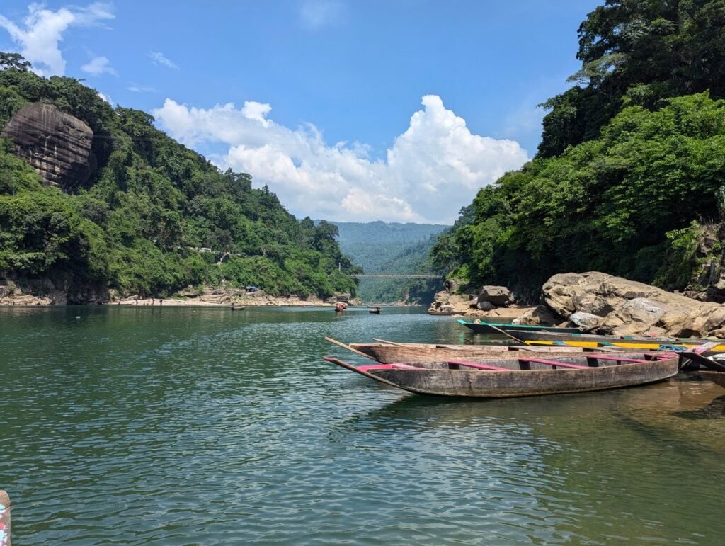 Boats on clear turquoise water in Meghalaya