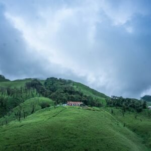 Green hills and guest house in Dzukou Valley, Nagaland