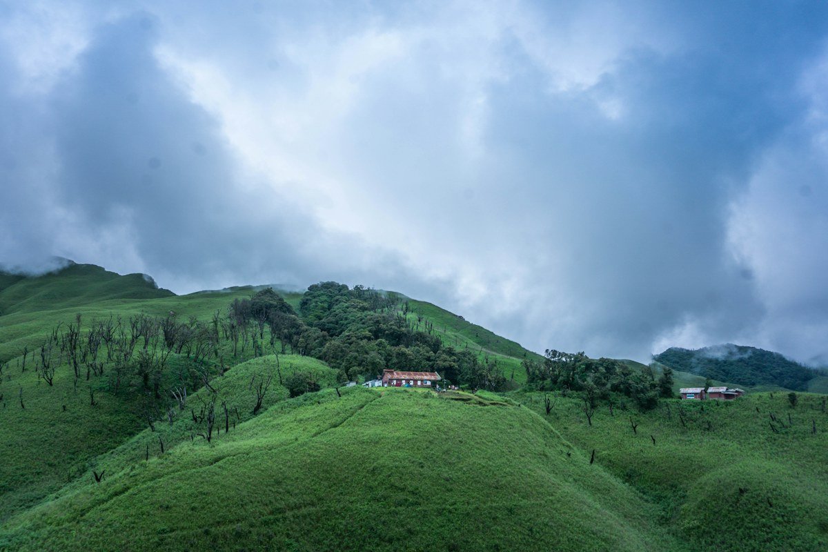 Green hills and guest house in Dzukou Valley, Nagaland